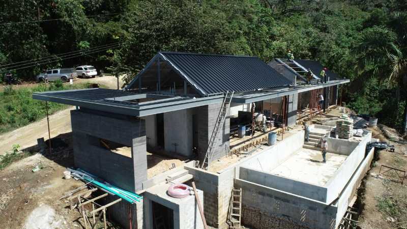 Home under construction at Nosara Estates showing structural progress and building framework in Nosara